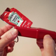 Spent ketchup packet in Heinz Packet Roller